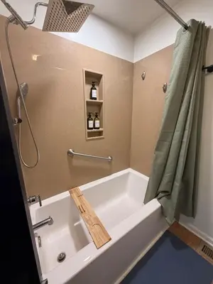 a bath tub in a bathroom with a shower at New Listing The Float House at Buckeye Lake in Thornville