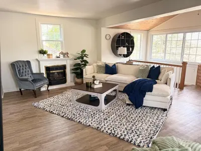 a living room with a couch and a table at New Listing The Float House at Buckeye Lake in Thornville
