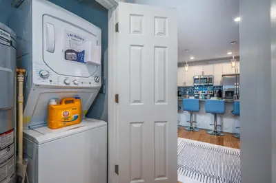 a laundry room with a washer and dryer at OTR by TQL, Lux King Bed, Sleeps 4ppl, Smart TVs, Fast Wifi, 3rd Fl in Cincinnati