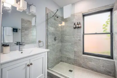 a bathroom with a sink and a shower at OTR by TQL, Lux King Bed, Sleeps 4ppl, Smart TVs, Fast Wifi, 3rd Fl in Cincinnati