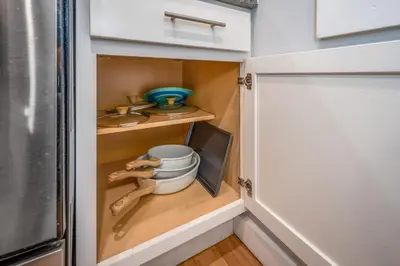 a kitchen with a cupboard with some utensils at OTR by TQL, Lux King Bed, Fast Wifi, Sleeps 6ppl, 1st Fl in Cincinnati