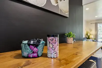 a vase filled with rocks sitting on top of a wooden table at 2BR with Private Hot Tub in Parma Heights