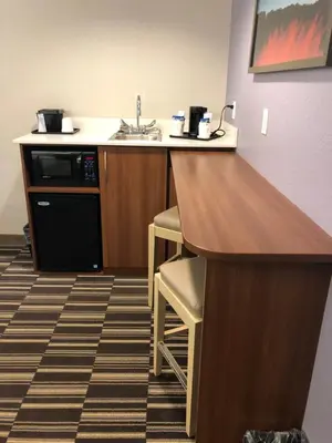 a kitchen with a sink and a counter top at Microtel Inn & Suites by Wyndham Cadiz in Cadiz