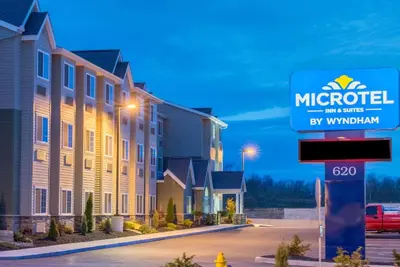 a sign for a microtel inn and suites at Microtel Inn & Suites by Wyndham Cadiz in Cadiz