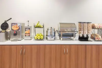 a counter with food items on top of it at Microtel Inn & Suites by Wyndham Cadiz in Cadiz