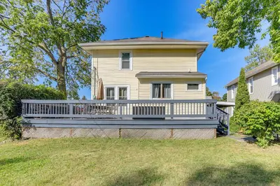 a house with a large deck on a yard at Walk to Port Clinton Lighthouse Home with Deck! in Port Clinton