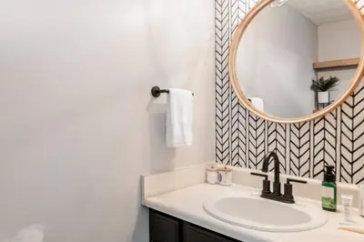 a bathroom with a sink and a mirror at Modern Boho Retreat, in Grove City in Grove City
