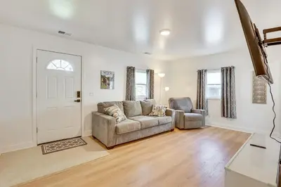 a living room with a couch and a chair at Easy I-80 Access! Newly Updated McDonald Home