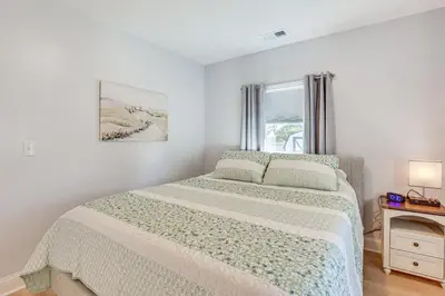 a white bedroom with a bed and a window at Easy I-80 Access! Newly Updated McDonald Home