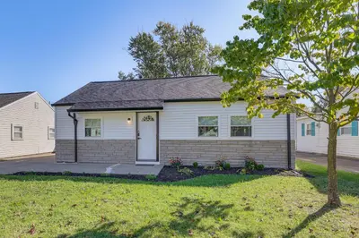 a house with a tree in front of it at Easy I-80 Access! Newly Updated McDonald Home