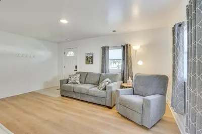 a living room with two chairs and a couch at Easy I-80 Access! Newly Updated McDonald Home