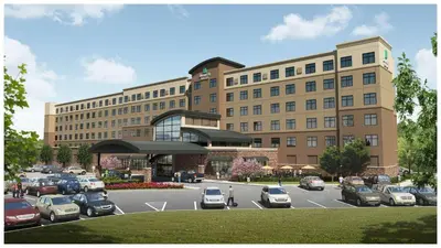 a rendering of a parking lot in front of a building at Embassy Suites by Hilton Akron Canton Airport in North Canton