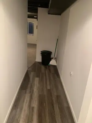 an empty room with a broom and a bucket at Nice Basement room in the house in Medina
