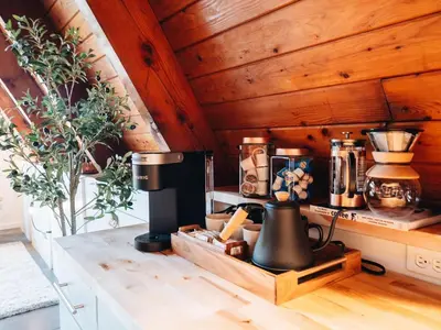 a kitchen with a coffee maker on a counter at Cozy A-Frame Getaway Minutes from Nelson Ledges