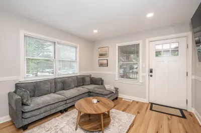 a living room with a couch and a table at Valley Ridge Retreat - For 8 in Cincinnati