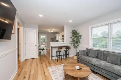 a living room with a couch and a table at Valley Ridge Retreat - For 8 in Cincinnati