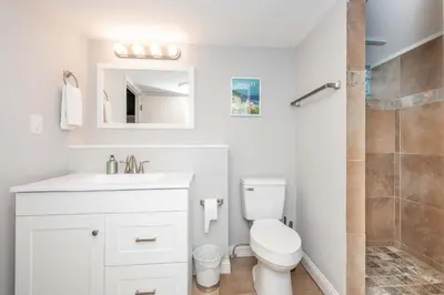 a bathroom with a toilet and a sink and a shower at Valley Ridge Retreat - For 8 in Cincinnati
