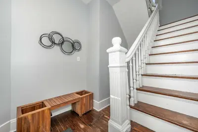 a stairway with a pair of glasses on the wall at Queen City Suites 2 - For 4 in Cincinnati