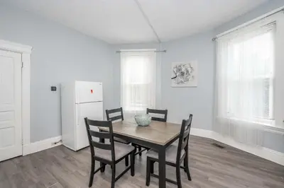 a dining room with a table and chairs at Queen City Suites - For 7 in Cincinnati