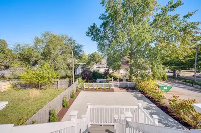 a park with a white bench and trees at 7 Mi to Dtwn and Lake Erie Sleek Cleveland Apt! in Cleveland