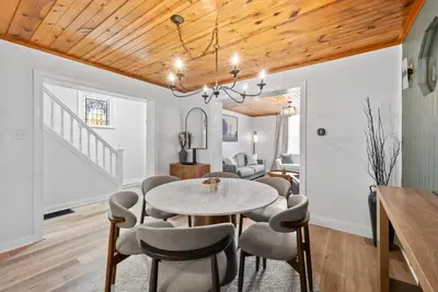 a dining room with a table and chairs at Wellness Retreat - Hot Tub Fire Pit Outdoor TV in Columbus