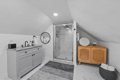 a white bathroom with a shower and a sink at Wellness Retreat - Hot Tub Fire Pit Outdoor TV in Columbus