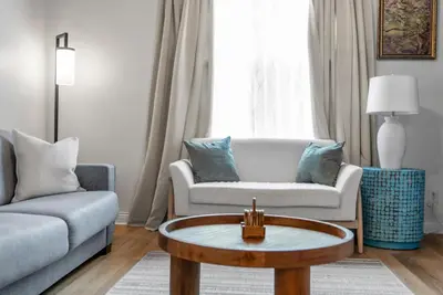 a living room with a couch and a coffee table at Wellness Retreat - Hot Tub Fire Pit Outdoor TV in Columbus