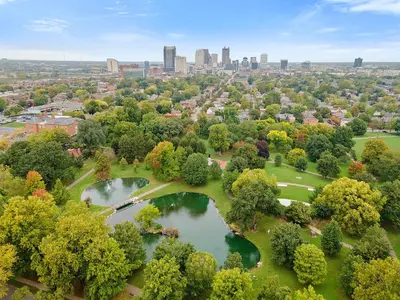 an overhead view of a park with two ponds and a city at Wellness Retreat - Hot Tub Fire Pit Outdoor TV in Columbus