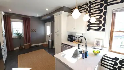 a kitchen with a sink and a counter at The Funky Fun Haus - Pickleball, Hot Tub, Arcade in Columbus
