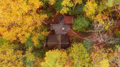 an aerial view of a house in the middle of a forest at Waterfront A Frame with Dock Canoe Kayaks Family in Rockbridge