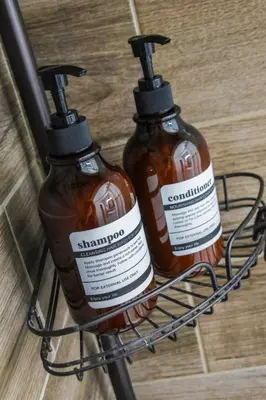 two bottles of hot sauce sitting on the back of a bike at Modern 3BR w Yard Garage in Columbus