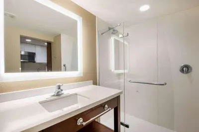 a bathroom with a sink and a shower at Hawthorn Suites by Wyndham Bridgeport in Bridgeport