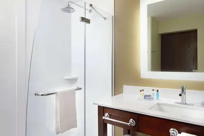 a bathroom with a sink and a shower at Hawthorn Suites by Wyndham Bridgeport in Bridgeport