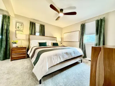 a bedroom with a bed and a ceiling fan at Brand new remodeled home in Monroe in Monroe
