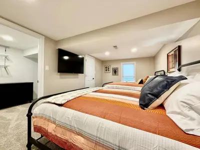 a bedroom with two beds and a flat screen tv at Brand new remodeled home in Monroe in Monroe