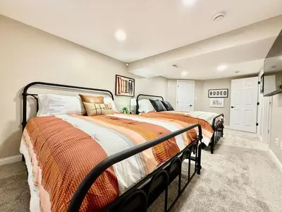 two beds are in a room with at Brand new remodeled home in Monroe in Monroe