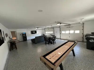 a living room with a ping pong table in it at Brand new remodeled home in Monroe in Monroe