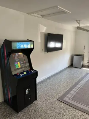 a video game system in a room with a tv at Brand new remodeled home in Monroe in Monroe