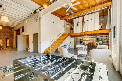 a kitchen with a stove top oven in a room at Walk to Huntington Center 5,000-Sq-Ft Dtwn Apt in Toledo