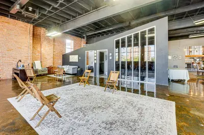 a room with chairs and a rug on the floor at Walk to Huntington Center 5,000-Sq-Ft Dtwn Apt in Toledo