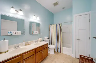 a bathroom with a sink and a toilet and a shower at Walk to UC and Hospitals! Cincy Home with Patio in Cincinnati