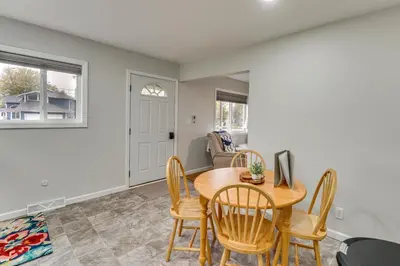 a dining room with a table and chairs at Walk to Lagoon Saloon! Chic Home on Nugents Canal in Port Clinton