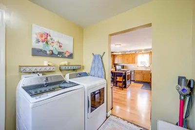 a kitchen with a washer and dryer in a room at 10 Mi to Mad River Mtn Family-Friendly Retreat! in West Liberty
