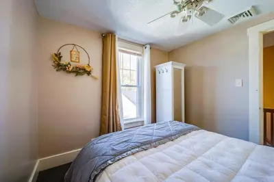 a bedroom with a bed and a window at 10 Mi to Mad River Mtn Family-Friendly Retreat! in West Liberty