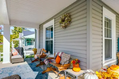 a porch with a wreath on the side of a house at 10 Mi to Mad River Mtn Family-Friendly Retreat! in West Liberty