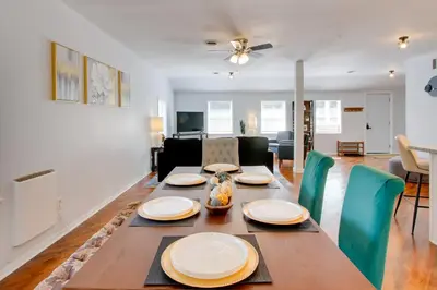 a dining room and living room with a table and chairs at Peaceful Country Apt Extended Stays Welcome! in Pataskala
