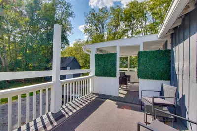 a porch of a house with two chairs at Peaceful Country Apt Extended Stays Welcome! in Pataskala