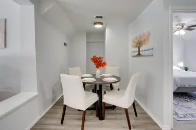 a dining room with a table and chairs and a bed at 21 Mi to Dtwn Columbus Quiet Country Escape in Pataskala