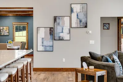 a living room with a couch and a table at Calaboose Retreat in Campton