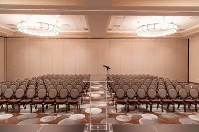 an empty room with chairs and a podium in it at Residence Inn by Marriott Cleveland Avon at The Emerald Event Center in Avon